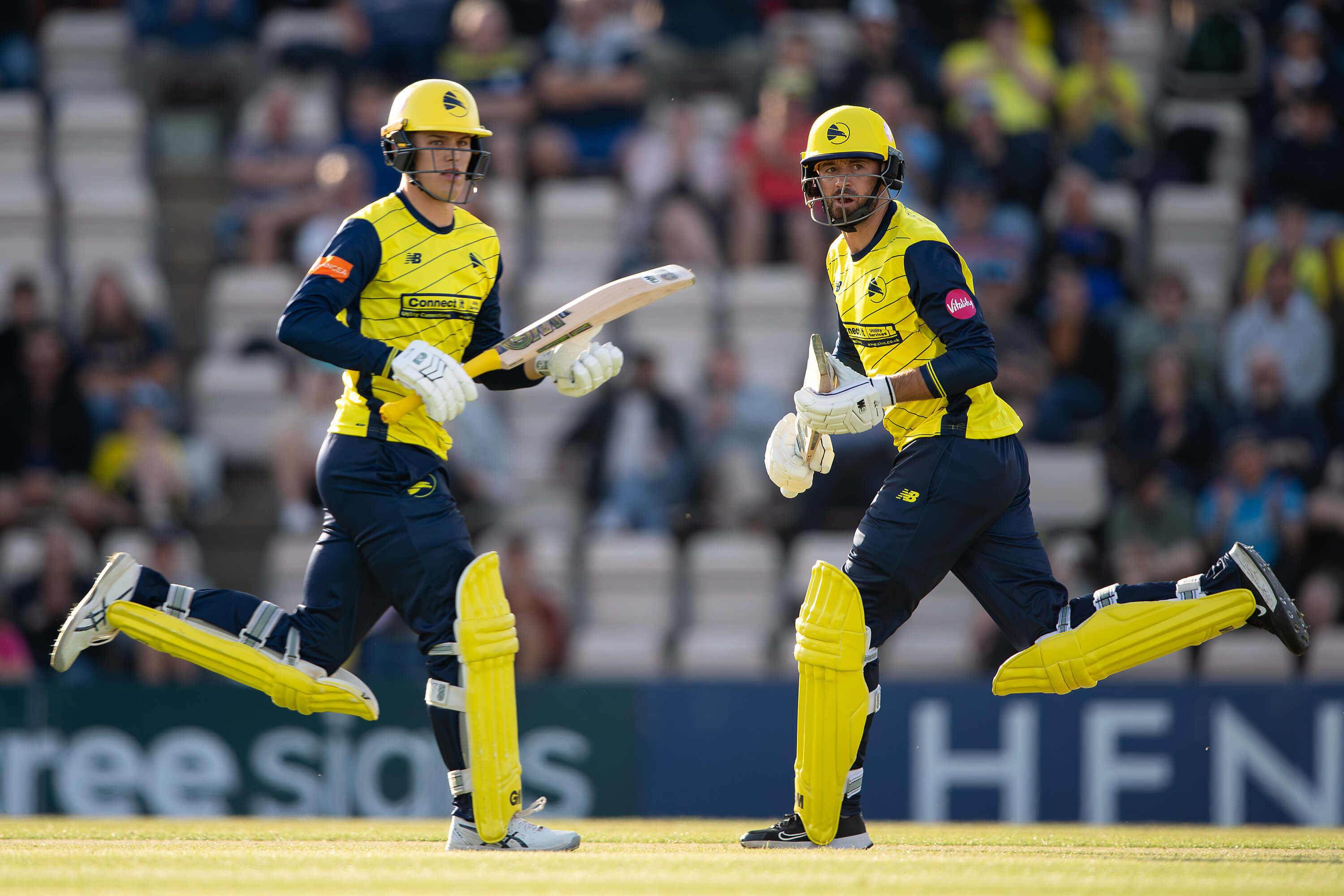 Toby Albert and James Vince run between the wickets during the Hawks' match against Glamorgan