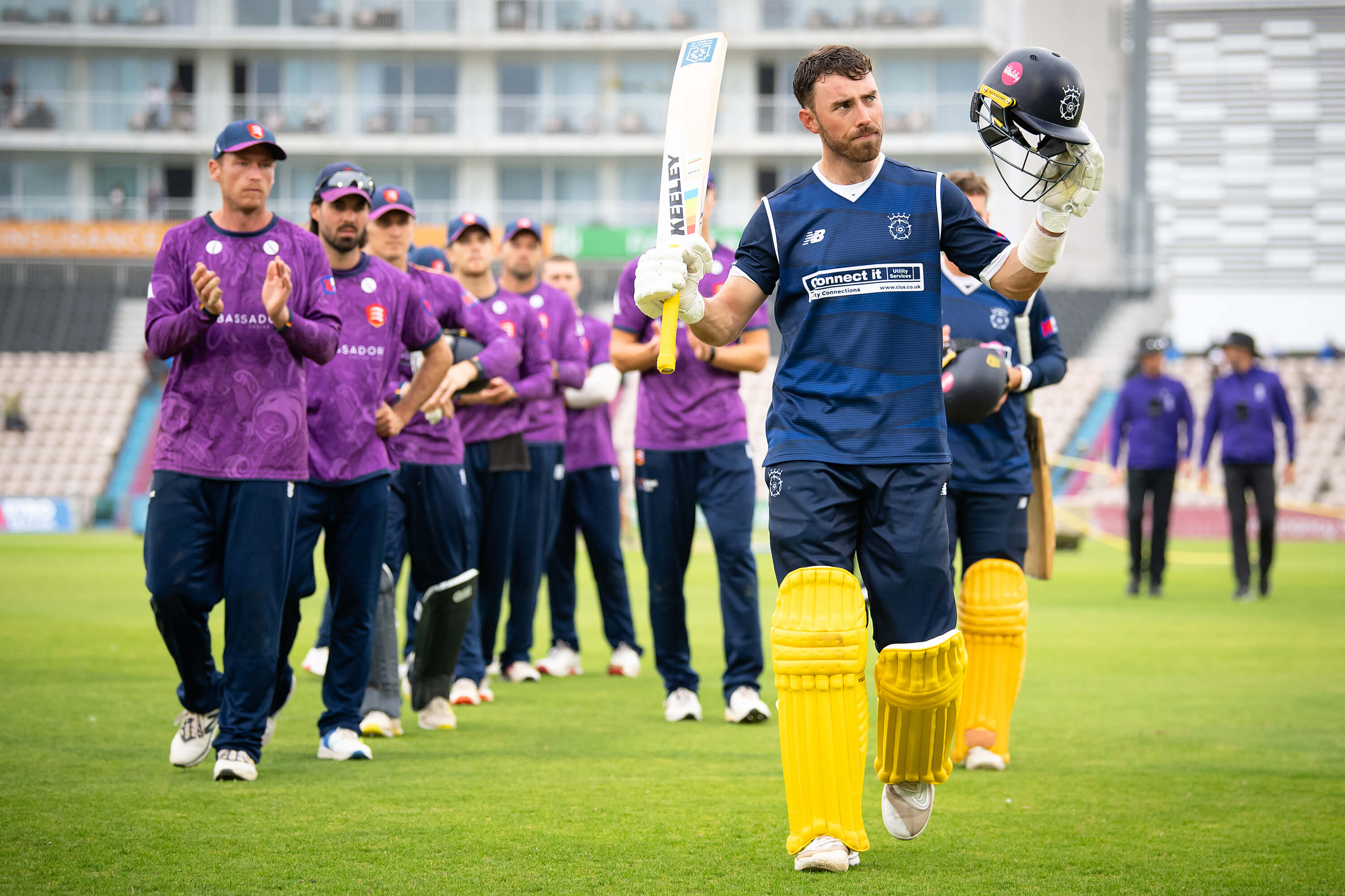 Joe Weatherley raises his bat and helmet to the crowd as he walks off finishing on 116* during the Metro Bank One Day Cup match against Essex at Utilita Bowl