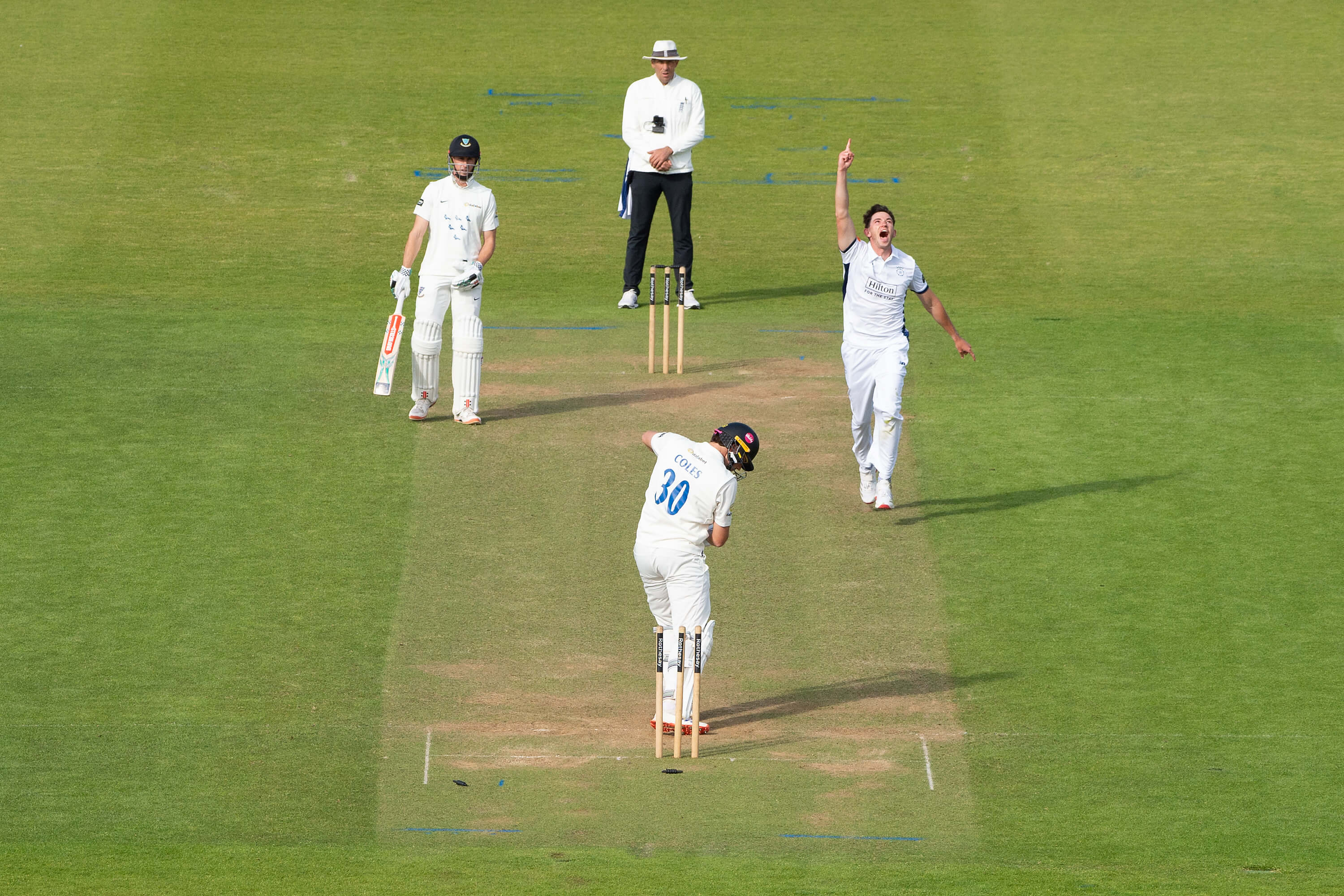 John Turner points to the sky having clean bowled Sussex's James Coles at Utilita Bowl