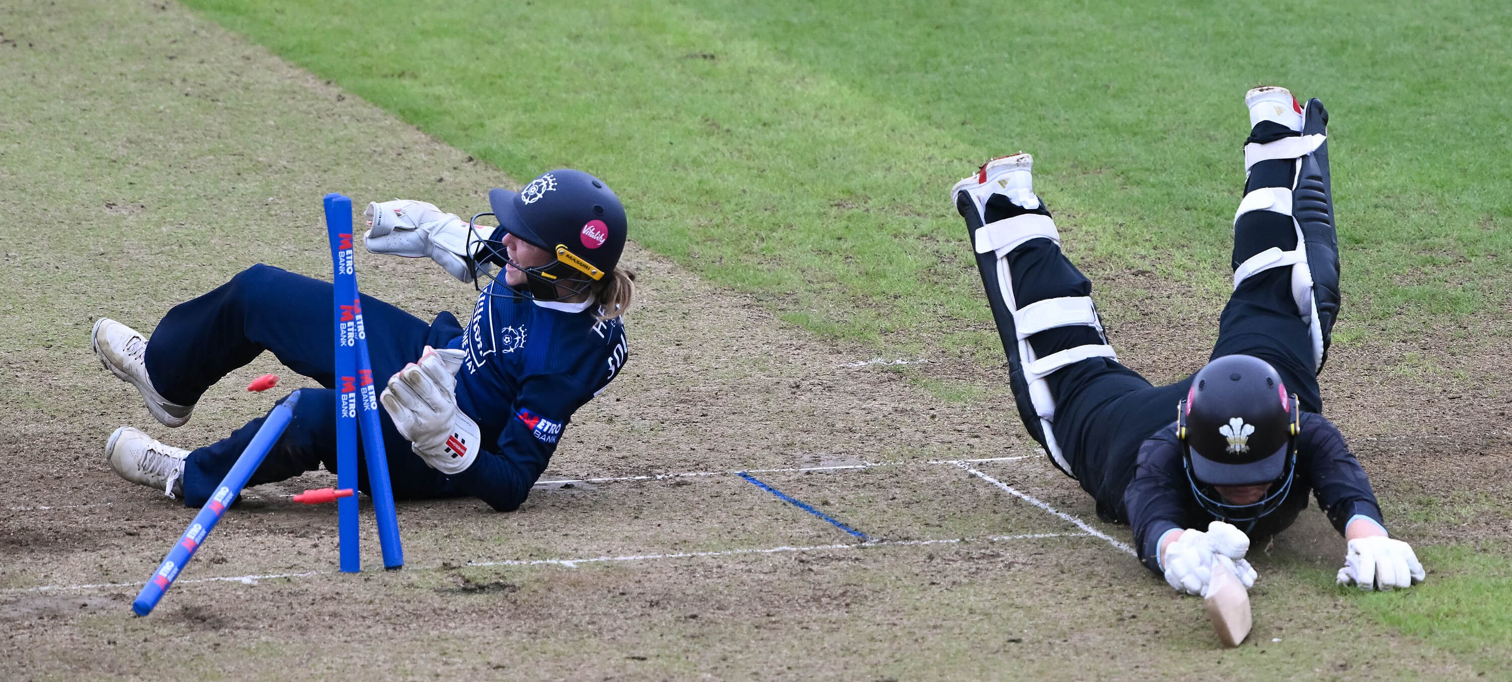 Rhianna Southby takes out the stumps to run out Surrey's Phoebe Franklin during Hampshire's Metro Bank One Day Cup match at Utilita Bowl