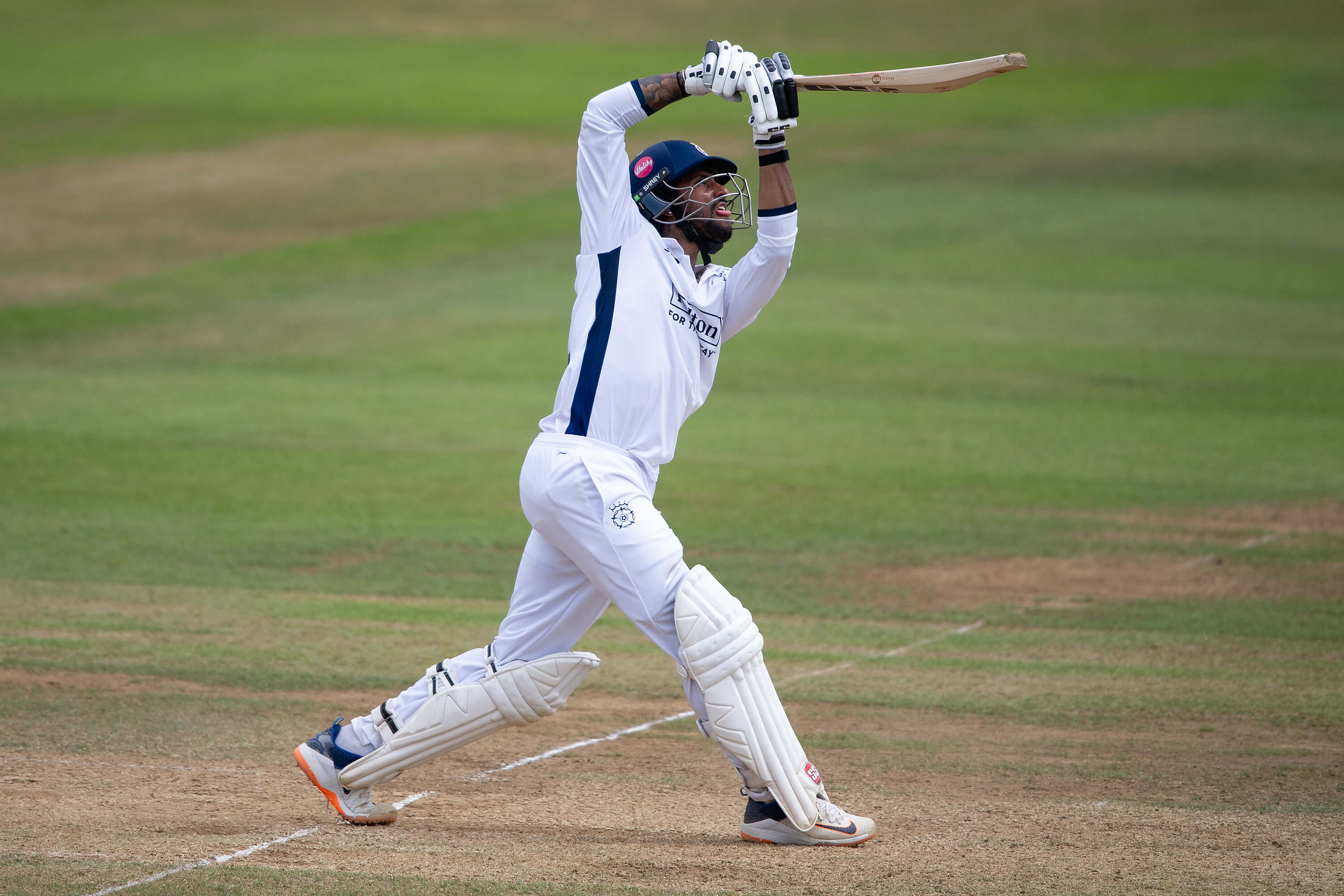 Tilak Varma extends his arms to drive during the County Championship